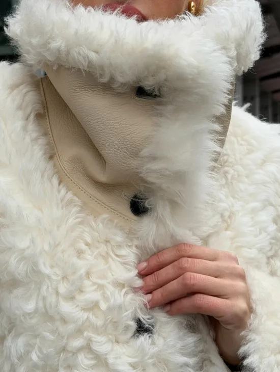 Белая шубка из тиградо